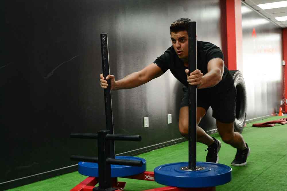 Sled push during an open workout session